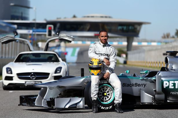 Mercedes driver Lewis Hamilton poses with the Mercedes F1 W04 during the launch at Circuito