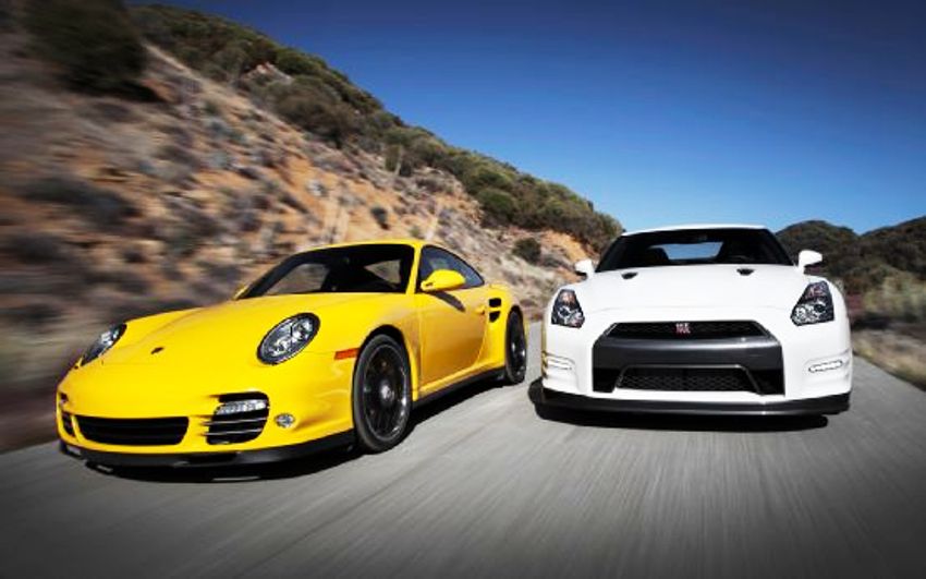 2013-nissan-gt-r-black-edition-2012-porsche-911-turbo-s-front-end-in-motion-2
