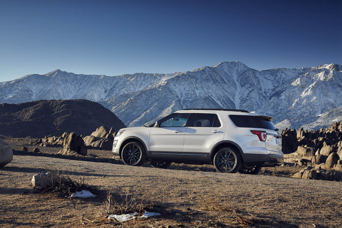Exterior updates on the 2017 Ford Explorer XLT Sport Appearance Package include 20-inch Magnetic Gray painted wheels and gloss black body side cladding. Preproduction model shown in White Platinum Metallic; available summer 2016.